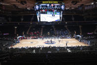 FILE - In this March 12, 2020, file photo, fans watch as Creighton takes on St. John's in an NCAA college basketball game in the quarterfinals of the Big East Conference tournament at Madison Square Garden in New York. As more than 300 teams prepare to start a season that will look nothing like any before it, the conversation is not so much about who will be cutting nets at the end of March Madness, as whether anyone will cut nets at all. (AP Photo/Mary Altaffer, File)