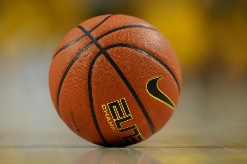 A basketball sits on the court during the second half of an NCAA college basketball game.