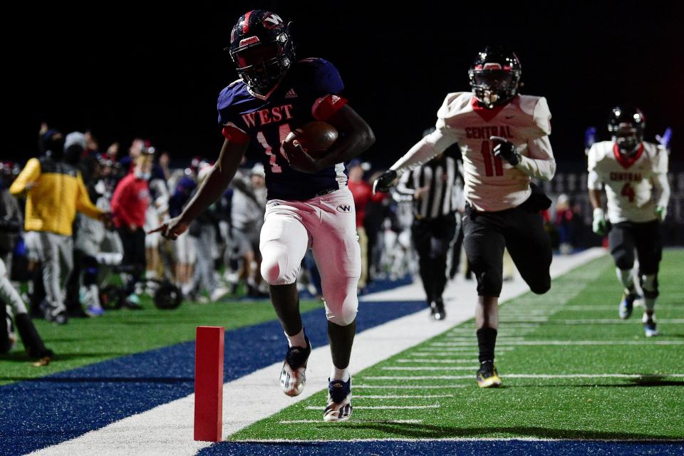 West's Brayden Latham (14) scores a touchdown during a 5A quarterfinal football game at West High School in Knoxville, Tenn. on Friday, Nov. 19, 2021.