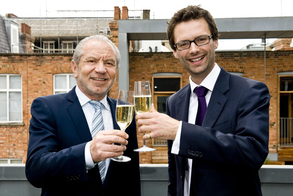 Lord Sugar toasting champagne with Tom Pellereau