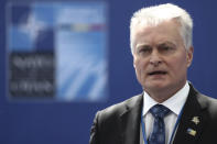 Lithuania's President Gitanas Nauseda speaks with the media as he arrives for a NATO summit at NATO headquarters in Brussels, Monday, June 14, 2021. U.S. President Joe Biden is taking part in his first NATO summit, where the 30-nation alliance hopes to reaffirm its unity and discuss increasingly tense relations with China and Russia, as the organization pulls its troops out after 18 years in Afghanistan. (Kenzo Tribouillard, Pool via AP)