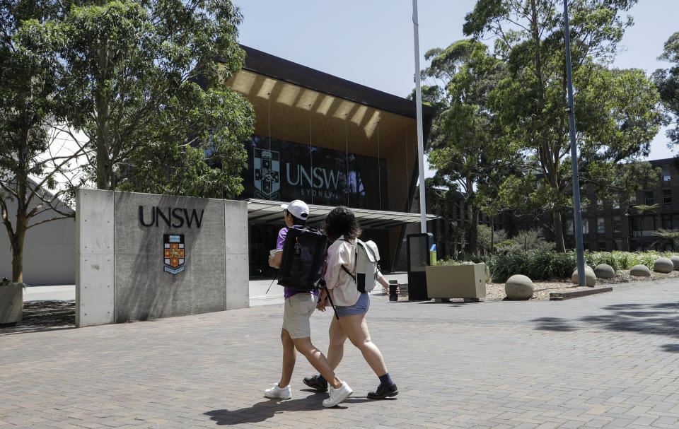 FILE - In this Dec 1, 2020, file photo, students walk around the University of New South Wales campus in Sydney, Australia. China's government and its supporters have harassed, intimidated and conducted surveillance on pro-democracy Chinese students living in Australia, and Australian universities have failed to protect the students' academic freedoms, Human Rights Watch said in a report published Wednesday, June 30, 2021. (AP Photo/Mark Baker, File)