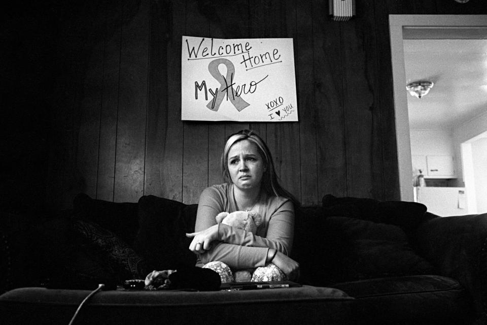 Stefanie Strausser mourns the death of her fiance, Staff Sergeant Cody Anderson at their apartment in Watertown, N.Y. January 2010.