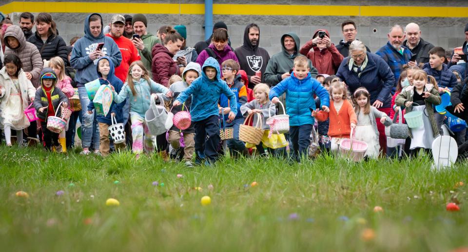 Kids race into the field of eggs at Willamalane’s annual “Megga” Easter egg hunt at Lively Park in Springfield in April 2023.