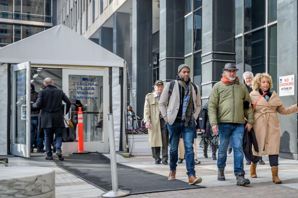 People leave a federal immigration courthouse in New York.