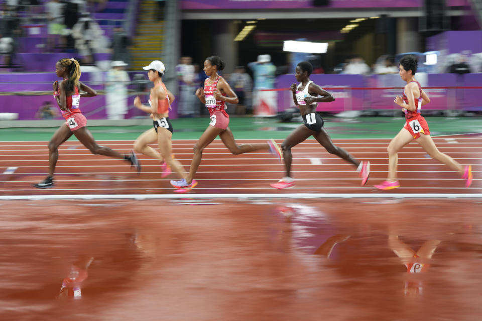 Runners compete during the women's 10000m final at the 19th Asian Games in Hangzhou, China, Friday, Sept. 29, 2023. (AP Photo/Lee Jin-man)