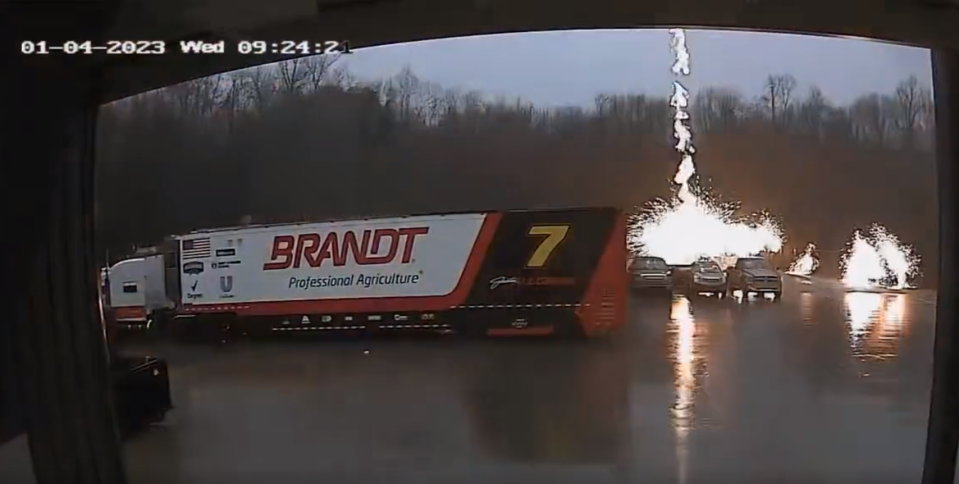 Sparks were flying Wednesday morning at the JR Motorsports shop as a bolt of lightning struck in a parking area, as seen in this screenshot from a video captured at the shop.