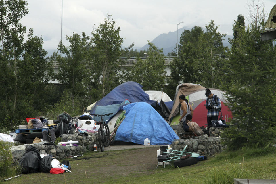 An outdoor tent city for the homeless is shown July 26, 2023, across from the city's historic railroad depot in downtown Anchorage, Alaska. Anchorage Mayor Dave Bronson announced a proposal last week to buy homeless people plane tickets out of the state or to other Alaska cities to avoid the frigid winter temperatures instead of standing up Anchorage's sports arena as a mass shelter. (AP Photo/Mark Thiessen)