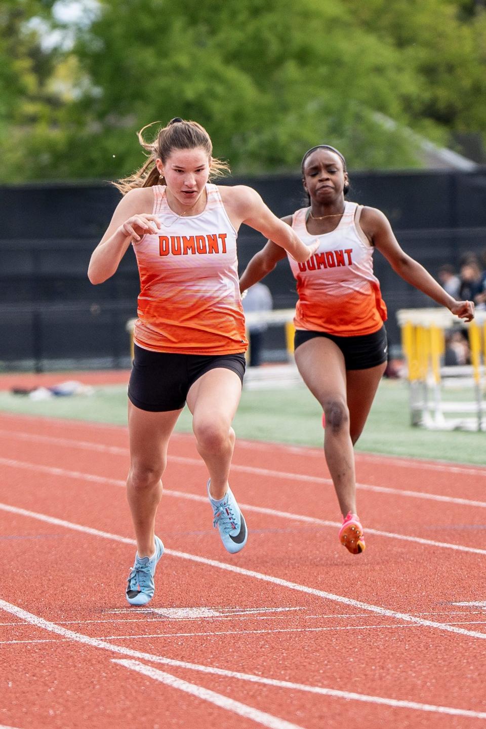 Jenna Monaco from Dumont finishes first in the American Division 100 meter dash. The Big North American and Patriot Division track and field championships take place at River Dell High School in Oradell, NJ on Friday, May 5, 2023.