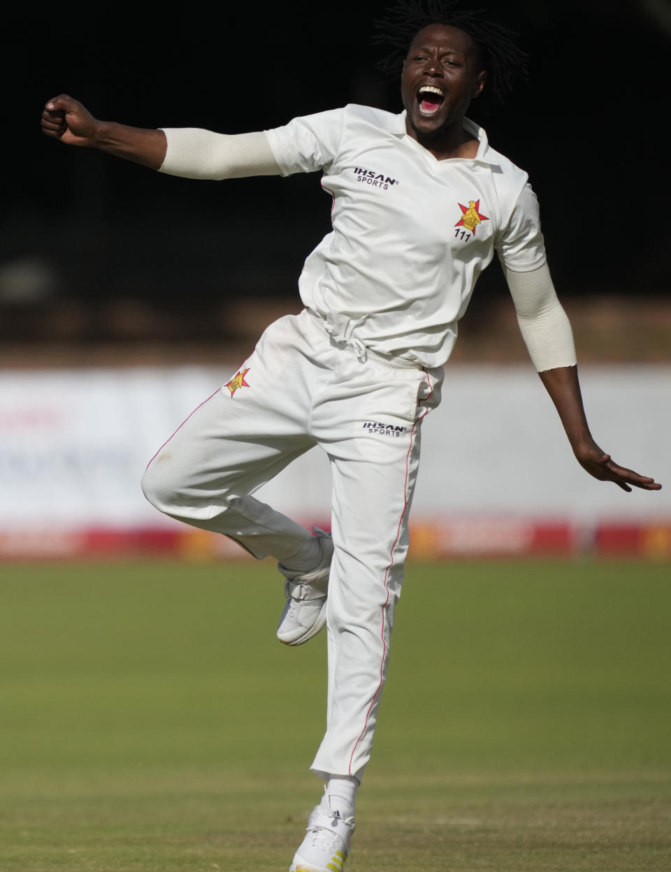 Zimbabwean bowler Victor Nyauchi celebrates a wicket on the second day of the second Test cricket match between Zimbabwe and West Indies at Queens Sports Club in Bulawayo, Zimbabwe, Monday, Feb. 13, 2023. (AP Photo/Tsvangirayi Mukwazhi)