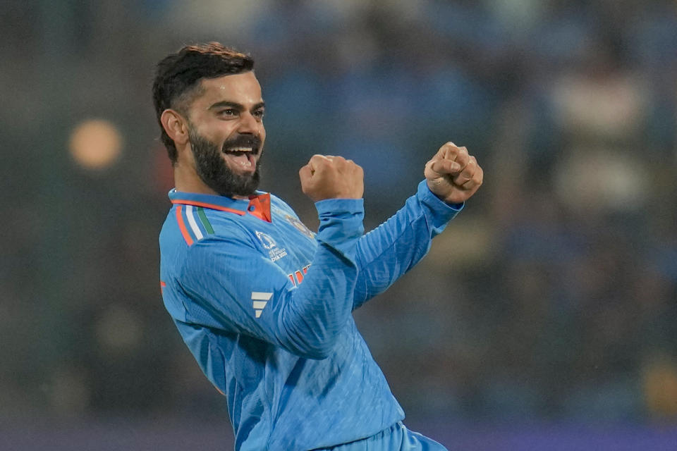 India's Virat Kohli celebrates the dismissal of Netherlands' captain Scott Edwards during the ICC Men's Cricket World Cup match between India and Netherlands in Bengaluru, India, Sunday, Nov. 12, 2023. (AP Photo/Aijaz Rahi)