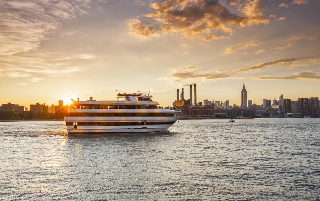 Cruise ship on East River in New York City at sunset, (Photo: Getty Images)