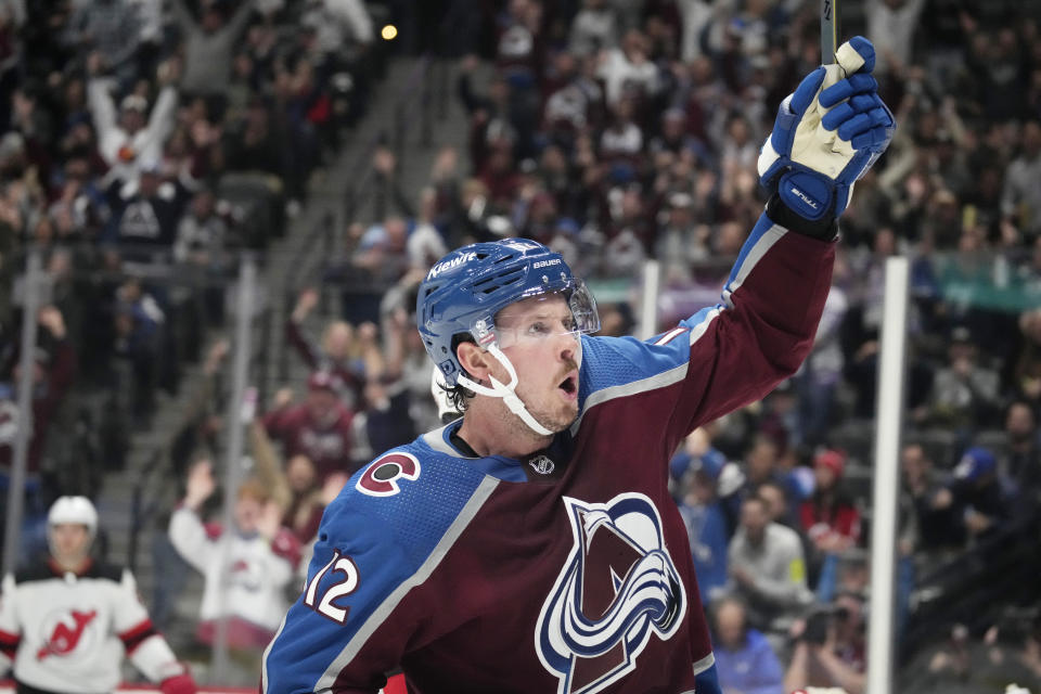 Colorado Avalanche center Ryan Johansen reacts after scoring a goal in the third period of an NHL hockey game against the New Jersey Devils on Tuesday, Nov. 7, 2023, in Denver. (AP Photo/David Zalubowski)