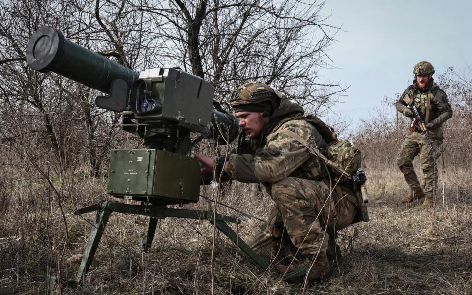 Ukrainian soldiers install an anti-tank missile systems 'Stugna' near Bakhmut, Donetsk region, Ukraine, Friday, March 17, 2023.