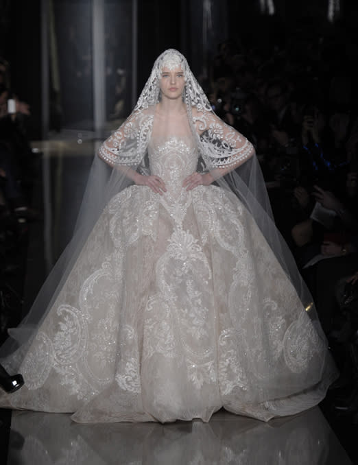<b>Elie Saab SS13 </b><br><br>Elie Saab introduced ultimate in extravagant wedding dresses with intricate embroidery and a matching veil.<br><br>©Rex