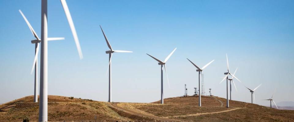 Ellensburg, Washington / USA - 07/12/2018:  Turbines spin in the wind at the Wind Turbines at Wild Horse Wind and Solar Engery Center Washington State, 2018