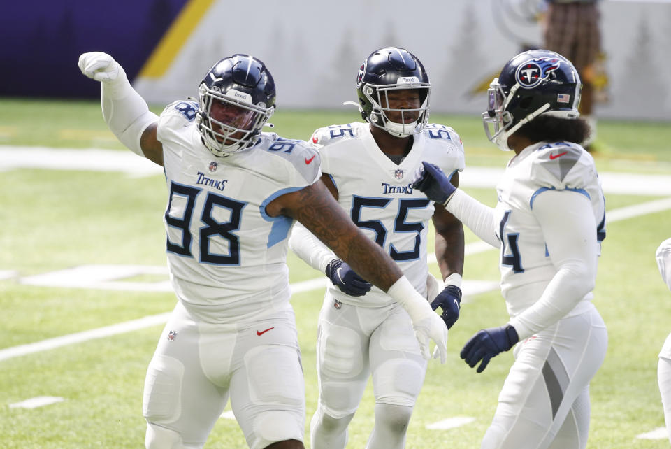 Tennessee Titans defensive tackle Jeffery Simmons (98) celebrates with teammates after a sack during the first half of an NFL football game against the Minnesota Vikings, Sunday, Sept. 27, 2020, in Minneapolis. (AP Photo/Bruce Kluckhohn)