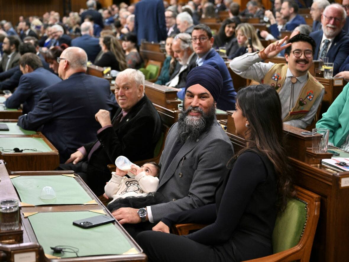 Jagmeet Singh, shown here in the House of Commons with his new baby, has good reasons to grin after the Liberals tabled their most recent budget. (Mandel Ngan/Associated Press - image credit)