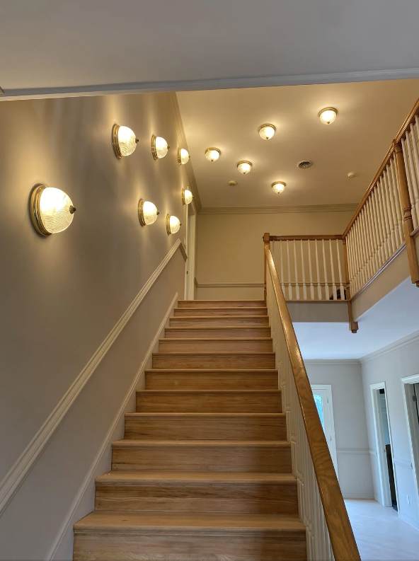 hallway up the stairs has a lights that look like boobs