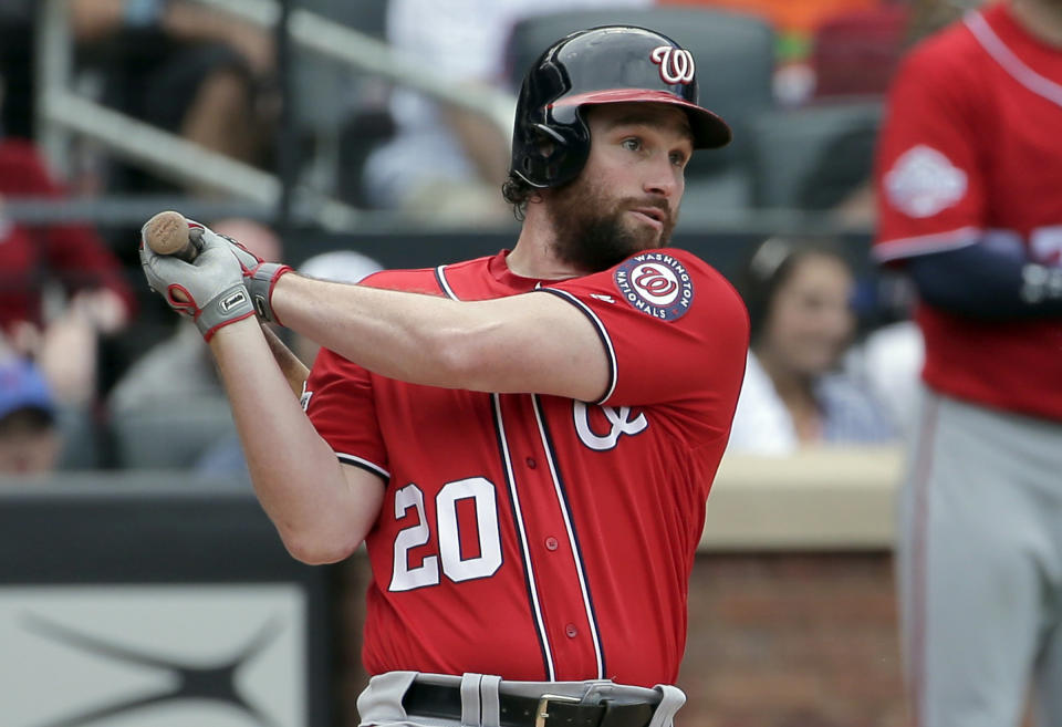 FILE - In this July 15, 2018, file photo, Washington Nationals' Daniel Murphy hits a two-run single during the seventh inning of a baseball game against the New York Mets at Citi Field in New York. The Nationals have traded second baseman Daniel Murphy to the Chicago Cubs and first baseman Matt Adams to the St. Louis Cardinals, essentially throwing in the towel on a disappointing season. The third-place Nationals announced the moves Tuesday, Aug. 21, 2018, before beginning a three-game series against the Philadelphia Phillies.(AP Photo/Seth Wenig, File)