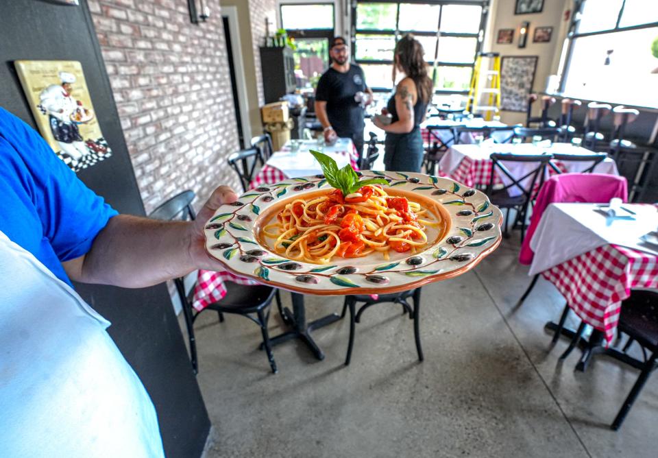 The food at Scotti's Salumeria in East Greenwich includes pasta dishes like this one, with imported Sicilian cherry tomatoes.