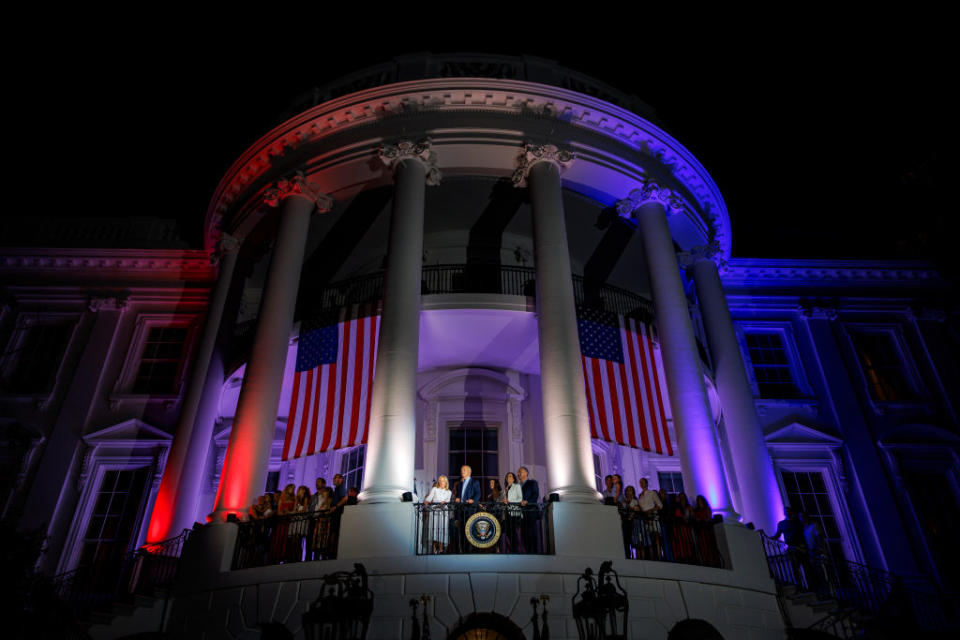 WASHINGTON, DC - JULY 04: President Joe Biden, First Lady Jill Biden, Vice President Kamala Harris, and Second Gentleman Doug Emhoff view the fireworks on the National Mall with family members and guests from the White House balcony during a 4th of July event on the South Lawn of the White House on July 4, 2024 in Washington, DC. The President is hosting the Independence Day event for members of the military and their families. (Photo by Samuel Corum/Getty Images)