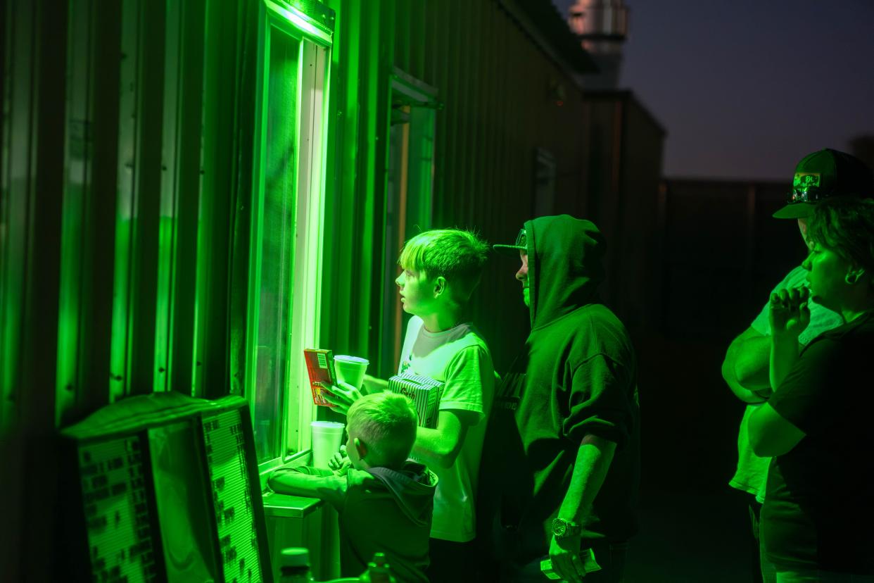 Customers get their fill of concession treats Friday night at the final show of the Tascosa Drive-in in Amarillo.