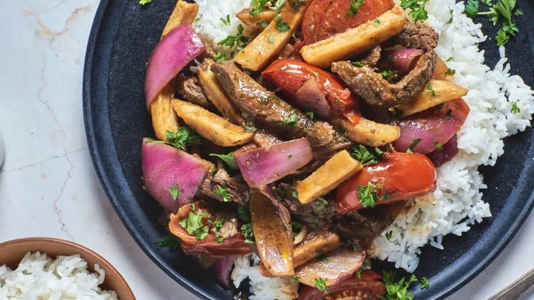 lomo saltado with rice, fries