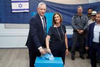 Leader of Blue and White party, Benny Gantz and his wife Revital cast their ballots as they vote in Israel's parliamentary election at a polling station in Rosh Ha'ayin, Israel