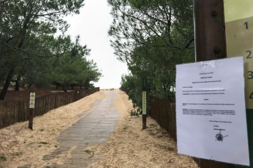 A sign forbidding access to the Plage du Gressier beach in Le Porge, southwestern France, on Monday, after packages thought to contain cocaine were found there on November 10