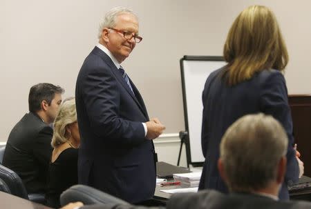 Attorney Andy Savage (L), an attorney working for former police officer Michael Slager, speaks with Ninth Circuit Solicitor Scarlett Wilson during jury selection in Slager's murder trial in Charleston, South Carolina, U.S. November 2, 2016. REUTERS/Grace Beahm/Pool