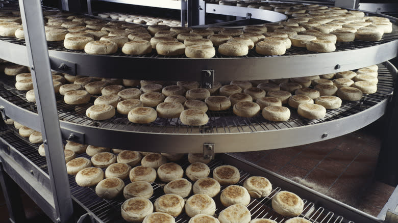 English muffins on conveyor belt