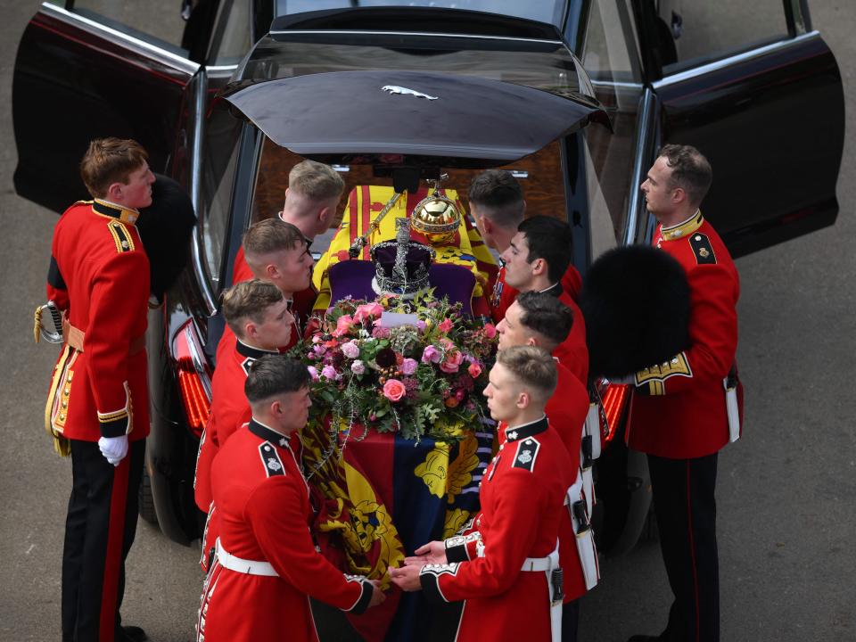 The Bearer Party transfer the coffin of Queen Elizabeth II, draped in the Royal Standard, into the State Hearse at Wellington Arch in London on September 19, 2022, after the State Funeral Service of Britain's Queen Elizabeth II.