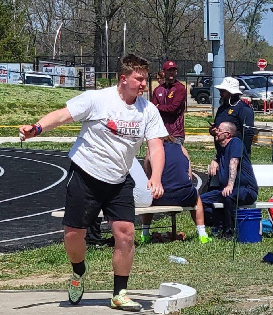 Edgewood sophomore Chris Davis watches his winning shot put effort of 50-4 land at the end of the pit during the Edgewood Invitational track meet on Saturday, April 23, 2022.