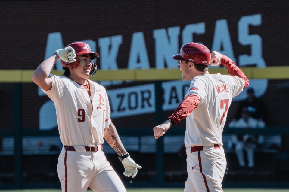 Arkansas baseball's Wehiwa Aloy celebrates after a base hit in the Hogs win over Missouri on Sunday, March 17, 2024.
