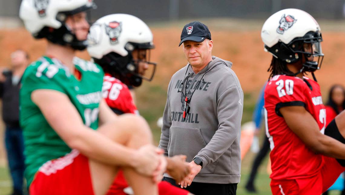 N.C. State head coach Dave Doeren watches as players warm up during the Wolfpack’s first spring practice Tuesday, Feb. 27, 2024.