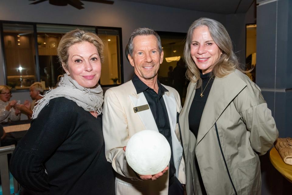 Melissa Morgan, Greg Murphy and Jan Harnik share a moment at The Joslyn Center's cocktail reception Moon Over Casa de Coalson on Nov. 7, 2022.
