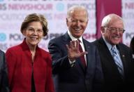 FILE PHOTO: Democratic U.S. presidential candidates Warren, Biden and Sanders stand onstage before the start of the sixth Democratic presidential candidates campaign debate at Loyola Marymount University in Los Angeles