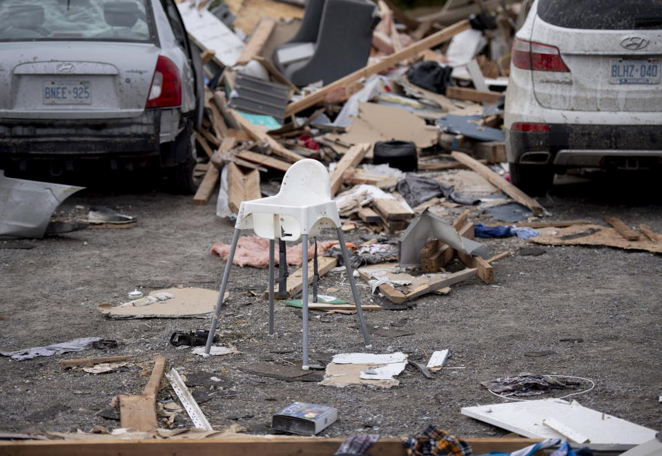 <p>A child’s high chair is seen in a driveway of a home destroyed by a tornado, in Dunrobin, Ont., west of Ottawa, on Sunday, Sept. 23, 2018. The storm tore roofs off of homes, overturned cars and felled power lines in the Ottawa community of Dunrobin and in Gatineau, Que. (Photo from Justin Tang/The Canadian Press) </p>