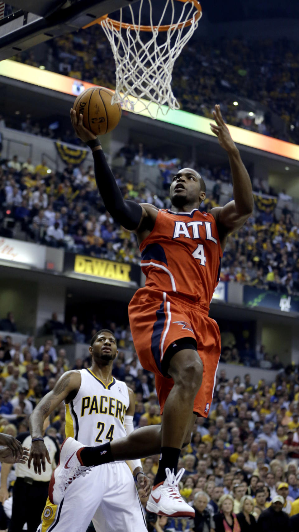 Atlanta Hawks' Paul Millsap (4) goes up for a shot against the Indiana Pacers during the first half in Game 5 of an opening-round NBA basketball playoff series Monday, April 28, 2014, in Indianapolis. (AP Photo/Darron Cummings)