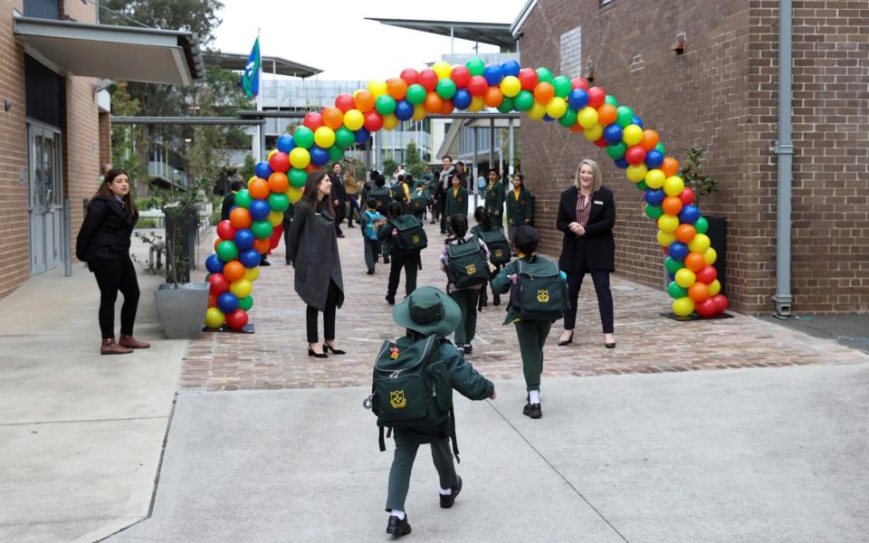 Children return to campus for the first day of New South Wales public schools fully re-opening for all students and staff  - Reuters