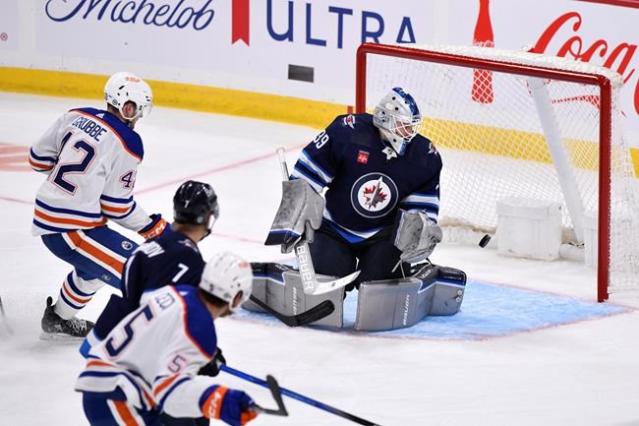 Winnipeg Jets preseason vs. Calgary Flames tonight, Connor Hellebuyck  starts in goal 