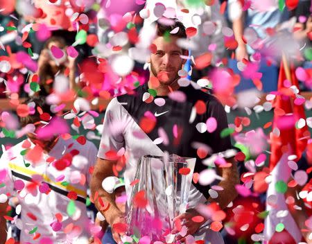 Mar 18, 2018; Indian Wells, CA, USA; Juan Martin Del Potro holds the championship trophy after defeating Roger Federer (not pictured) in the men's finals in the BNP Paribas Open at the Indian Wells Tennis Garden. Mandatory Credit: Jayne Kamin-Oncea-USA TODAY Sports