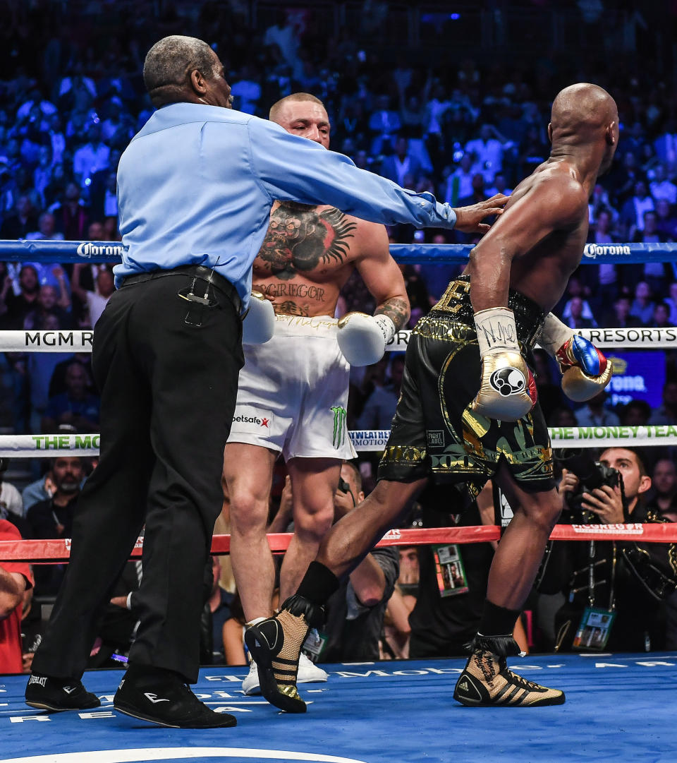 Nevada , United States - 26 August 2017; Referee Robert Byrd separates Floyd Mayweather Jr, right, from Conor McGregor after calling an end to the welterweight boxing match between Floyd Mayweather Jr v Conor McGregor at T-Mobile Arena in Las Vegas, USA. (Photo By Stephen McCarthy/Sportsfile via Getty Images)