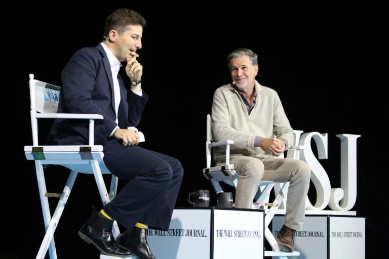 Netflix co-founder and chief executive Reed Hastings (R) talks with Wall Street Journal financial editor Dennis Berman at the WSJD Live conference in Laguna Beach, California