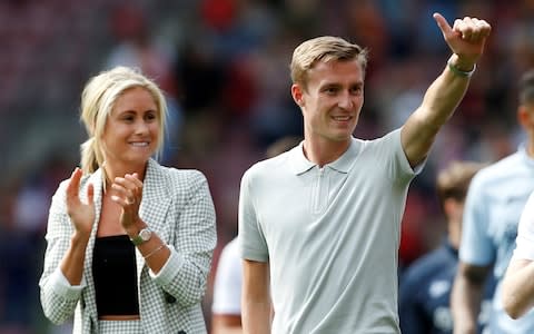 Stephen Darby gestures to the fans alongside his wife, Steph Houghton, after a charity game - Credit: Action Images via Reuters/Ed Sykes