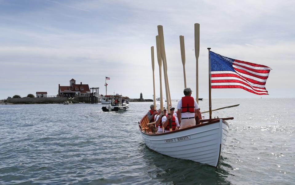 Crew members on the Mervin F Roberts fully restored 1930s rescue boat successfully rowed to the Wood Island Life Saving Station in Kittery, Maine, Friday, Sept. 30, 2022.