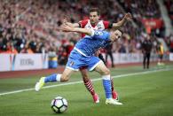 <p>Southampton’s Cedric Soares and AFC Bournemouth’s Dan Gosling, front, battle for the ball </p>