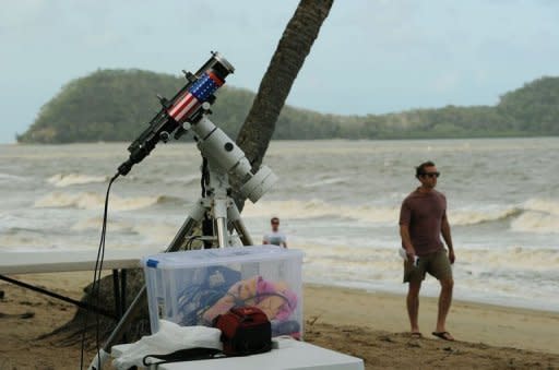 Equipment to watch the solar eclipse is set up early on the beach at Palm Cove in tropical north Queensland. Scientists were studying the effects of the eclipse on the marine life of the Great Barrier Reef and Queensland's rainforest birds and animals while psychologists were monitoring the impact on humans