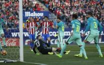 Football Soccer - Atletico Madrid v Barcelona - Spanish La Liga Santander - Vicente Calderon Stadium, Madrid, Spain, 26/02/17 Barcelona's Lionel Messi (3rd R) scores a goal past Atletico Madrid's goalkeeper Jan Oblak. REUTERS/Susana Vera